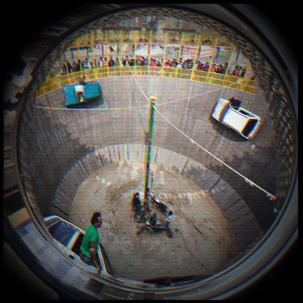 Cars and motorbikes on a wheel of death inside a washing machine